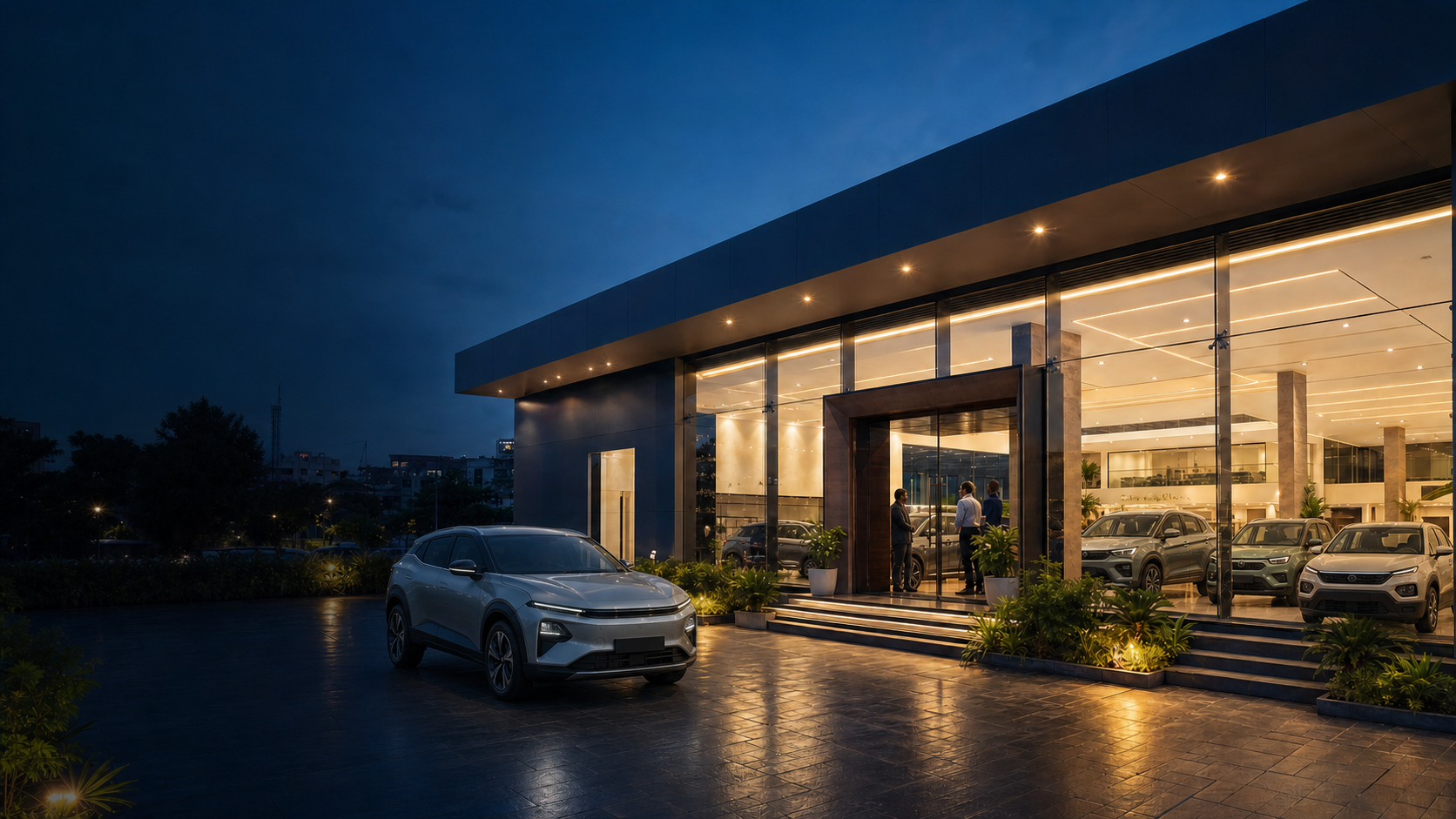 A premium Kamu Motors showroom at blue hour
